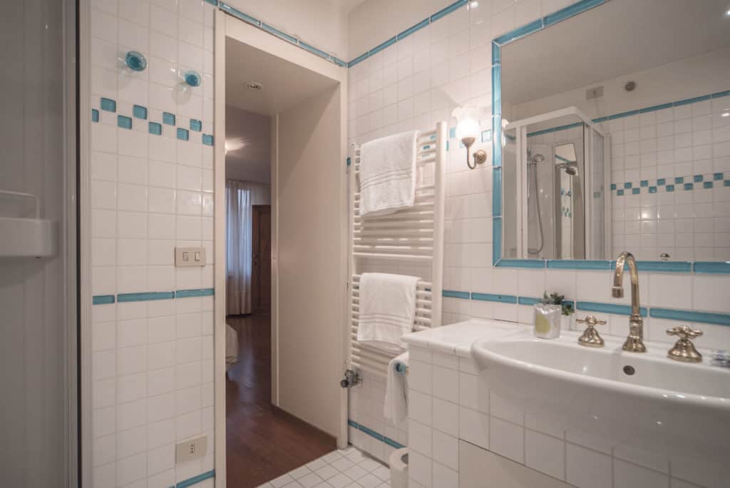Exit of large white bathroom - Accademia Terrazza Apartment Exit of large white bathroom - Accademia Terrazza Apartment