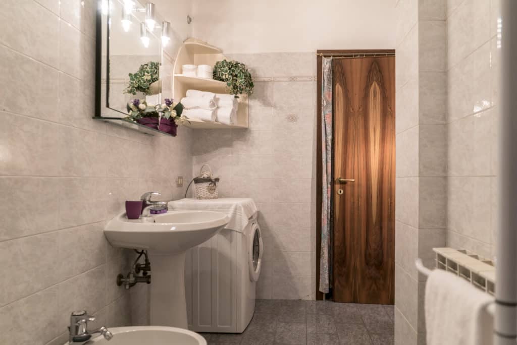 Entrance of the large bathroom with washing machine - Arsenal Flat Apartment Entrance of the large bathroom with washing machine - Arsenal Flat Apartment