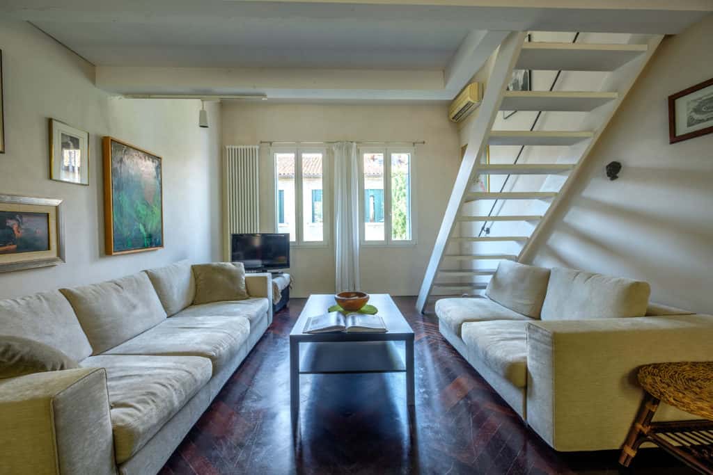 Large open space livingroom with stairs - Attico Terrace Apartment Large open space livingroom with stairs - Attico Terrace Apartment