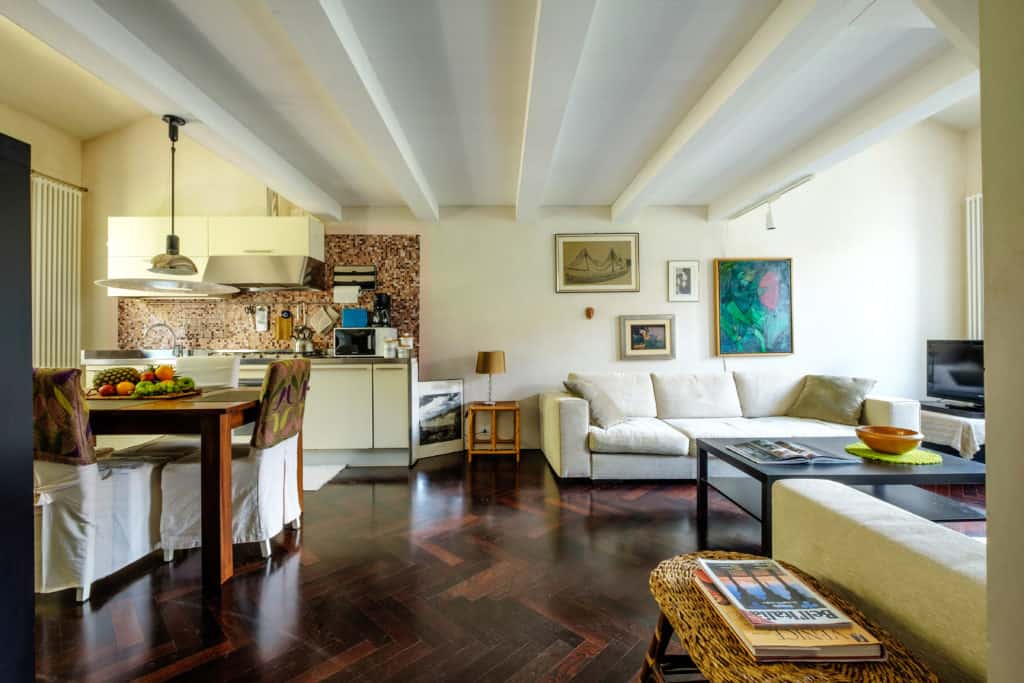 Large open common area that includes the kitchen, dining, and living area - Attico Terrace Apartment Large open common area that includes the kitchen, dining, and living area - Attico Terrace Apartment