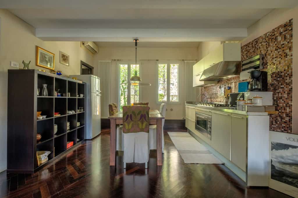Large open common area that includes the kitchen and dining area- Attico Terrace Apartment Large open common area that includes the kitchen and dining area- Attico Terrace Apartment