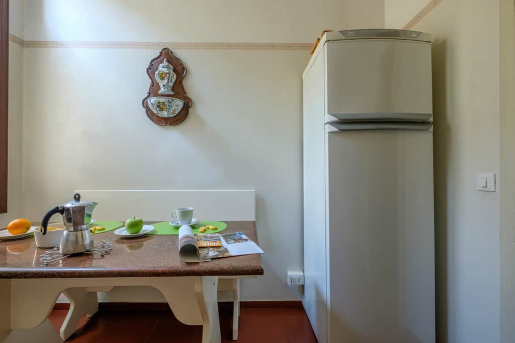 Small dining table with fridge - Ca' Affresco 1 Apartment Small dining table with fridge - Ca' Affresco 1 Apartment