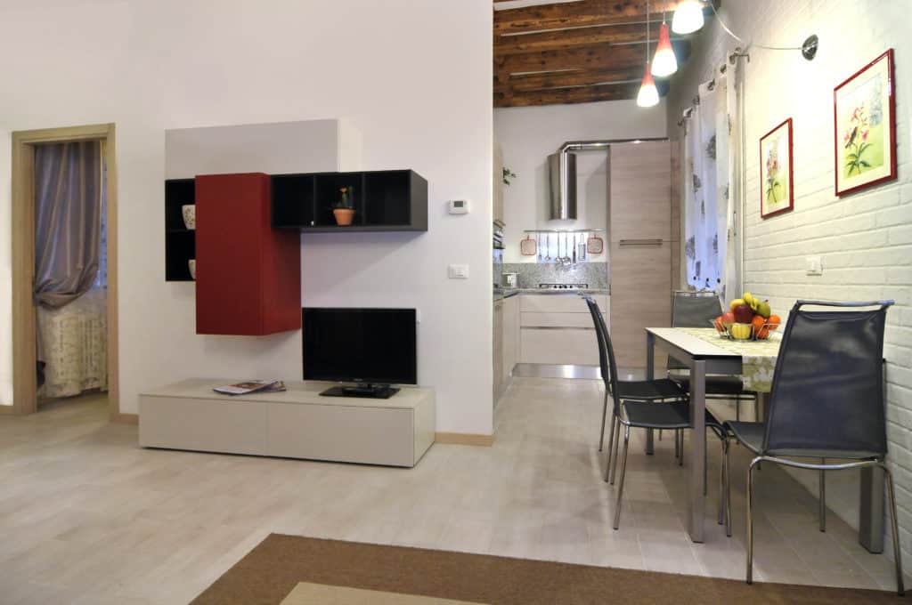 Open air living and dining room with modern furnishing - Ca' Dorina Apartment Open air living and dining room with modern furnishing - Ca' Dorina Apartment