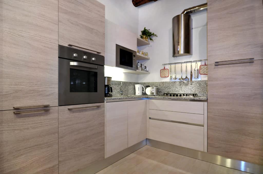 Small kitchen with modern furnishing - Ca' Dorina Apartment Small kitchen with modern furnishing - Ca' Dorina Apartment