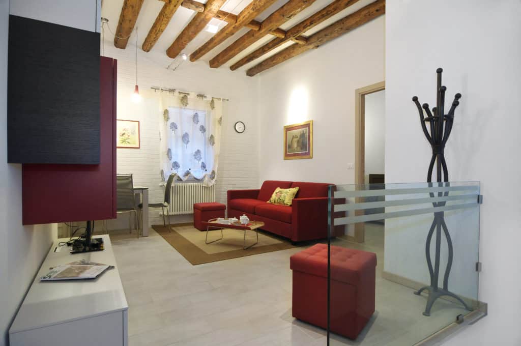 Right view of the large living room with modern furnishing - Ca' Dorina Apartment Right view of the large living room with modern furnishing - Ca' Dorina Apartment