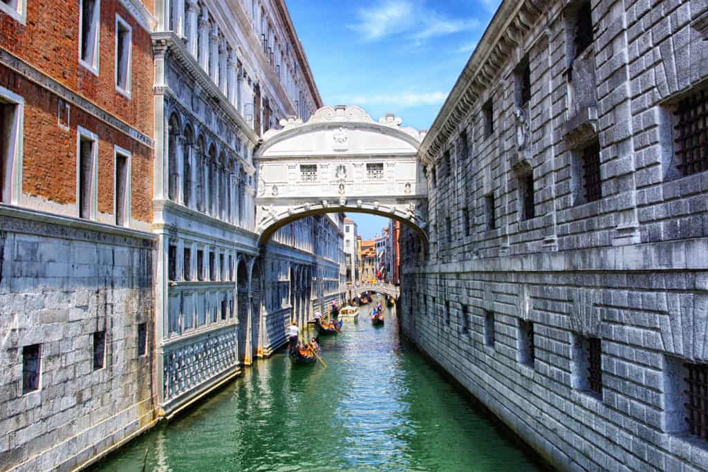 Bridge of Sighs, canal and gondolas between Palazzo Ducale and the Prigioni. Sestiere di Castello Bridge of Sighs, canal and gondolas between Palazzo Ducale and the Prigioni. Sestiere di Castello
