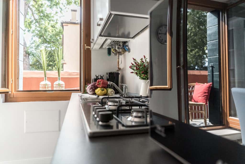 Details of the kitchen with view on the terrace - Venier Apartment Details of the kitchen with view on the terrace - Venier Apartment