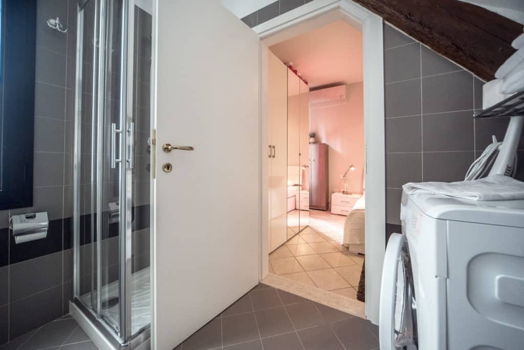 Entrance of the small bathroom with modern furnishing - Venier Apartment Entrance of the small bathroom with modern furnishing - Venier Apartment