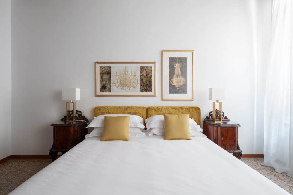 Detail of the master bed with vintage furnishing - Casa Graziosa Apartment Detail of the master bed with vintage furnishing - Casa Graziosa Apartment