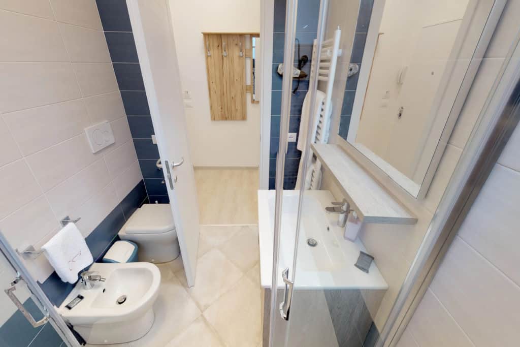 Entrance door of the small bathroom with modern furnishing - Casa Luminosa Apartment Entrance door of the small bathroom with modern furnishing - Casa Luminosa Apartment