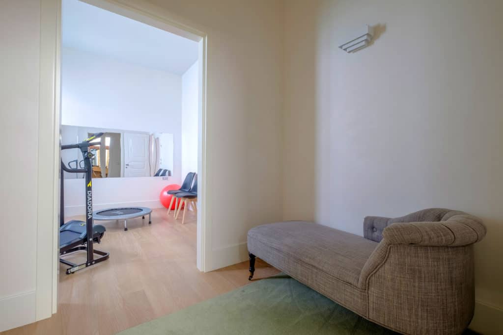 Entrance of the gym with lounge chair - Palazzo Molin Tiziano Apartment Entrance of the gym with lounge chair - Palazzo Molin Tiziano Apartment