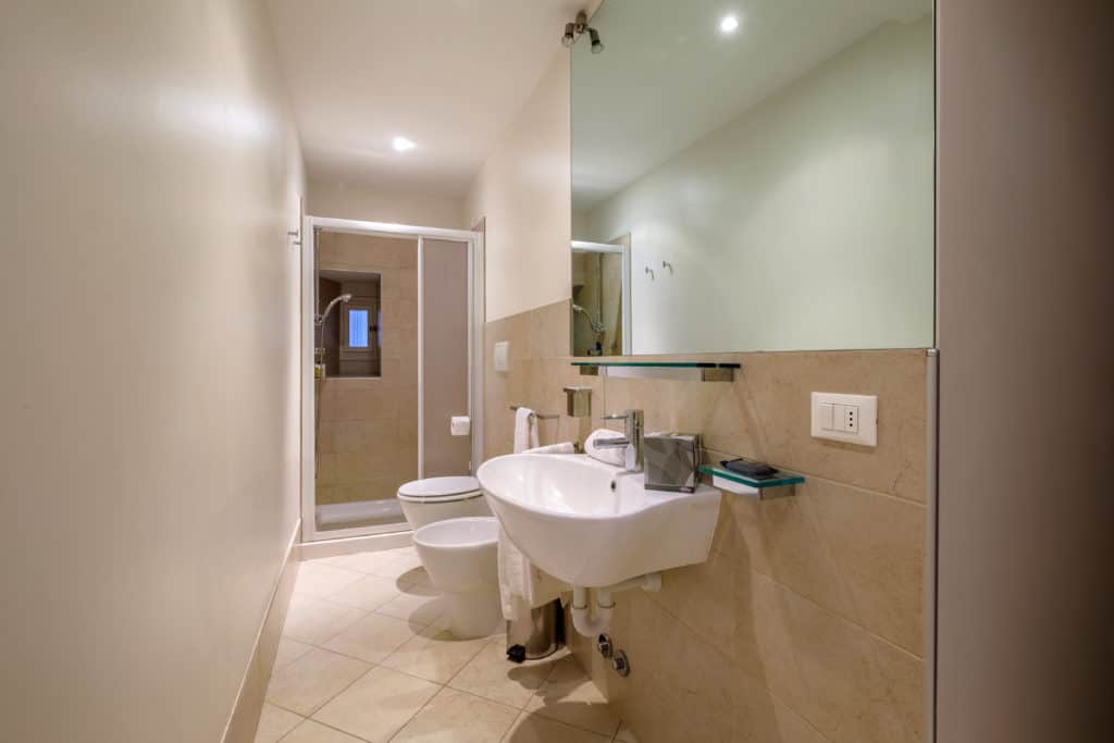 Large bathroom with shower and modern furnishing - The Lion's 2 Apartment Large bathroom with shower and modern furnishing - The Lion's 2 Apartment