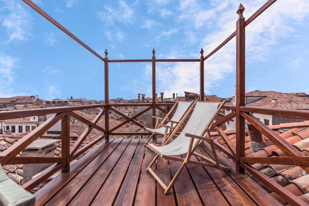 Open air terrace with deckchairs and view on the Venetian roofs - The Venetian Penthouse Apartment Open air terrace with deckchairs and view on the Venetian roofs - The Venetian Penthouse Apartment